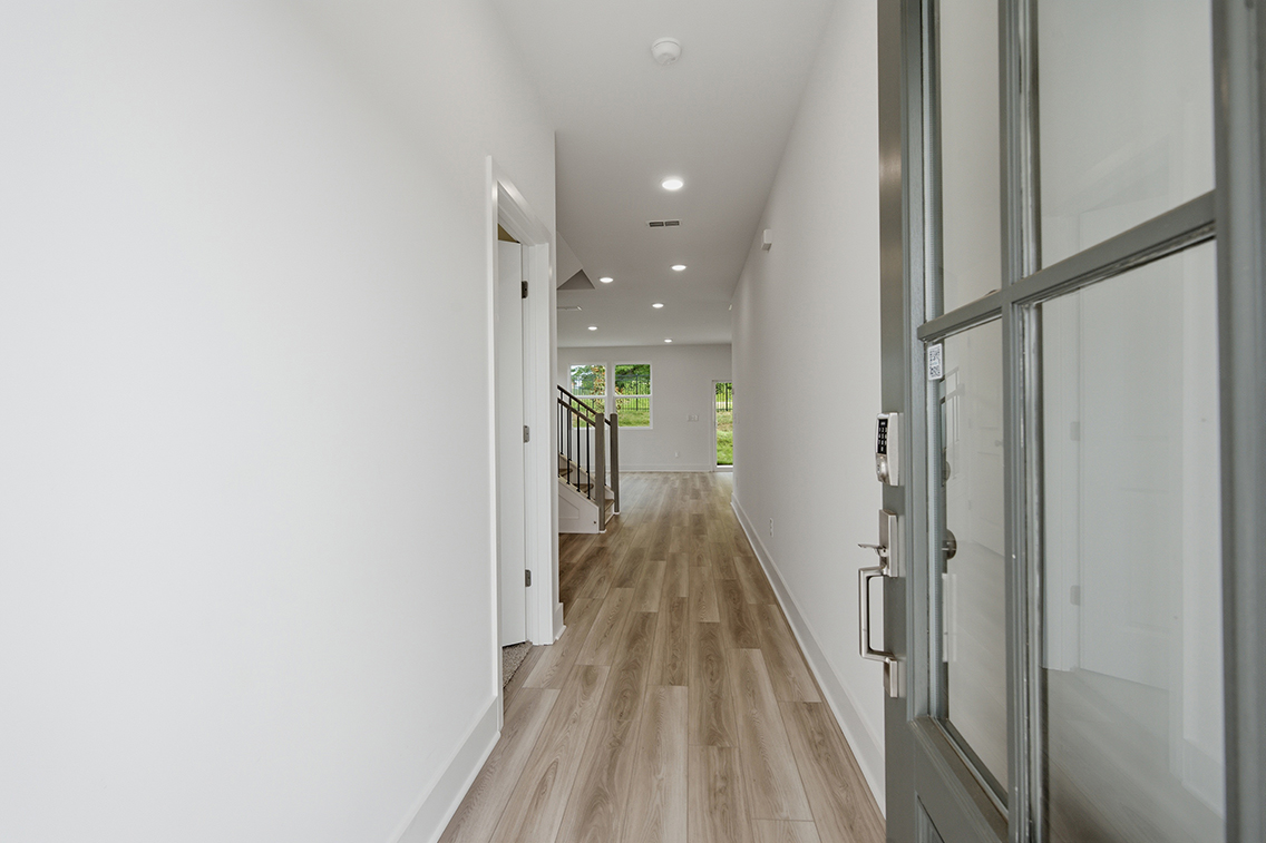 A hallway with glass doors.