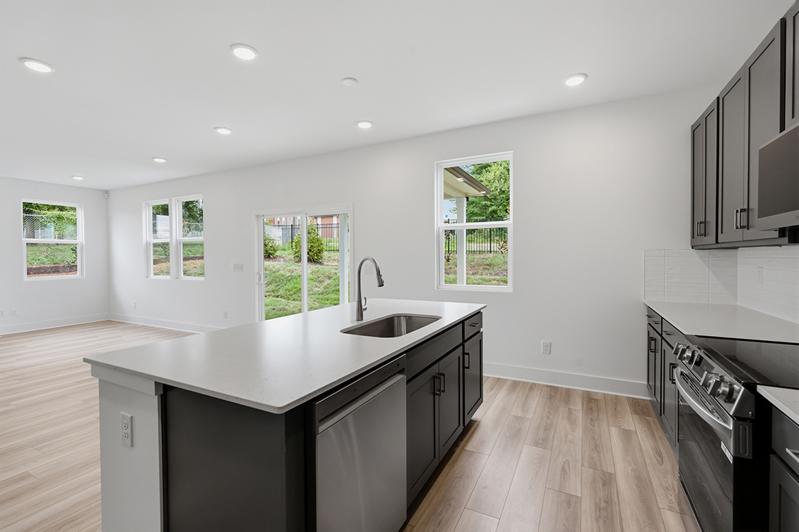 A kitchen with a sink and cabinets.