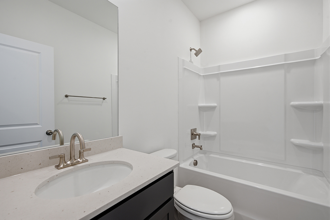 A bathroom with a sink and a toilet.