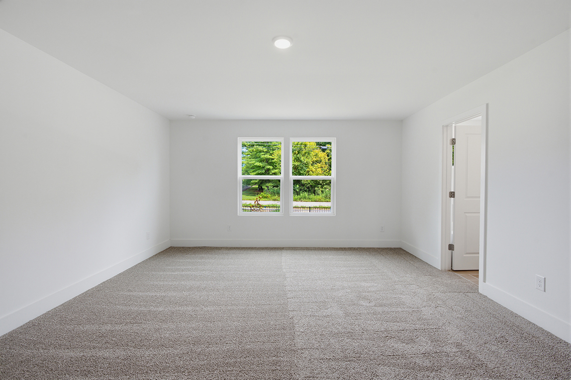A room with a window and a door.