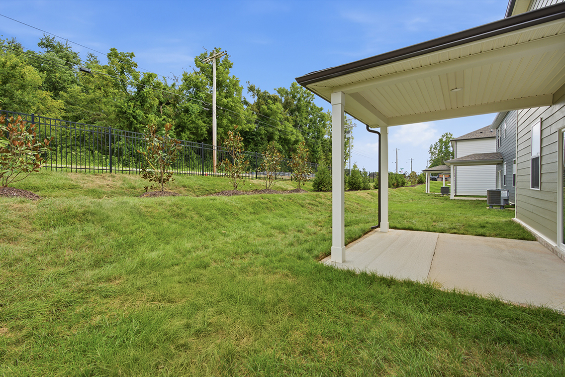 A house with a grass yard.