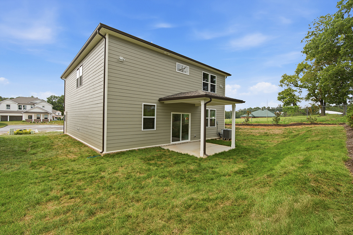 A house with a grass yard.
