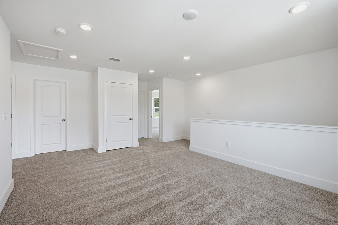 A room with white walls and white doors.