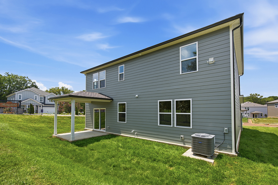 A house with a grass yard.