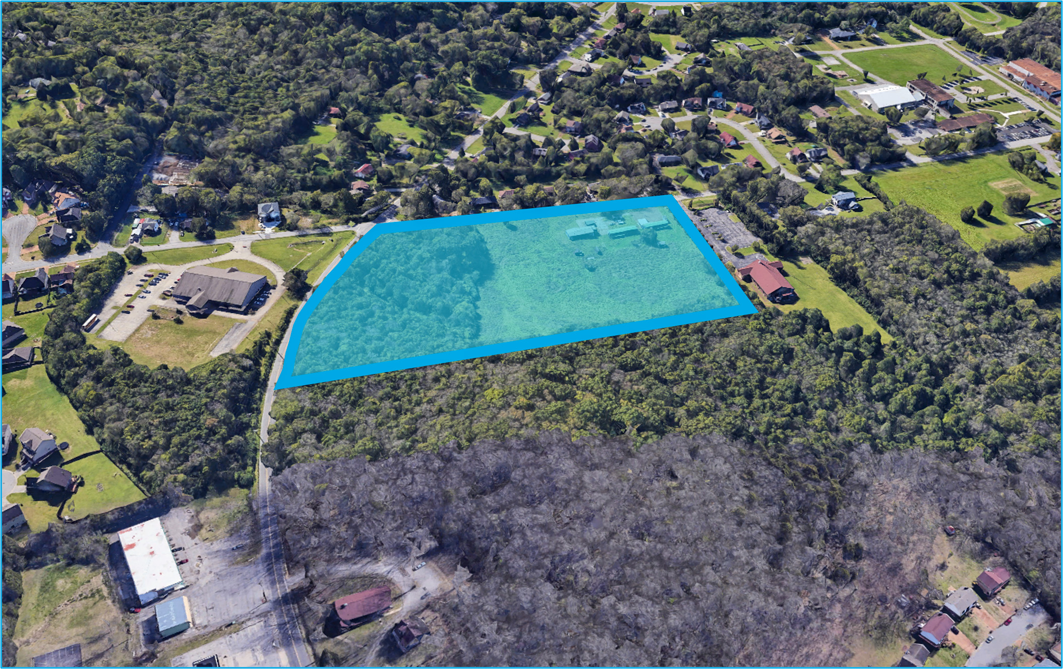 A large blue pool surrounded by trees.