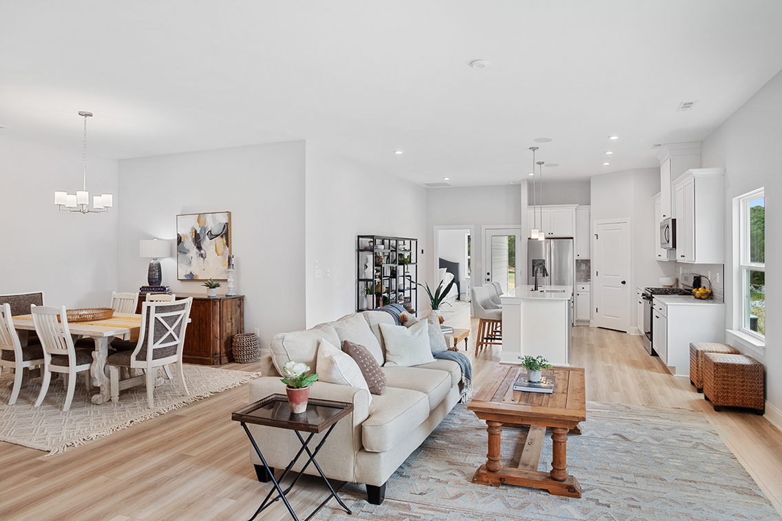 A living room with a wood floor.