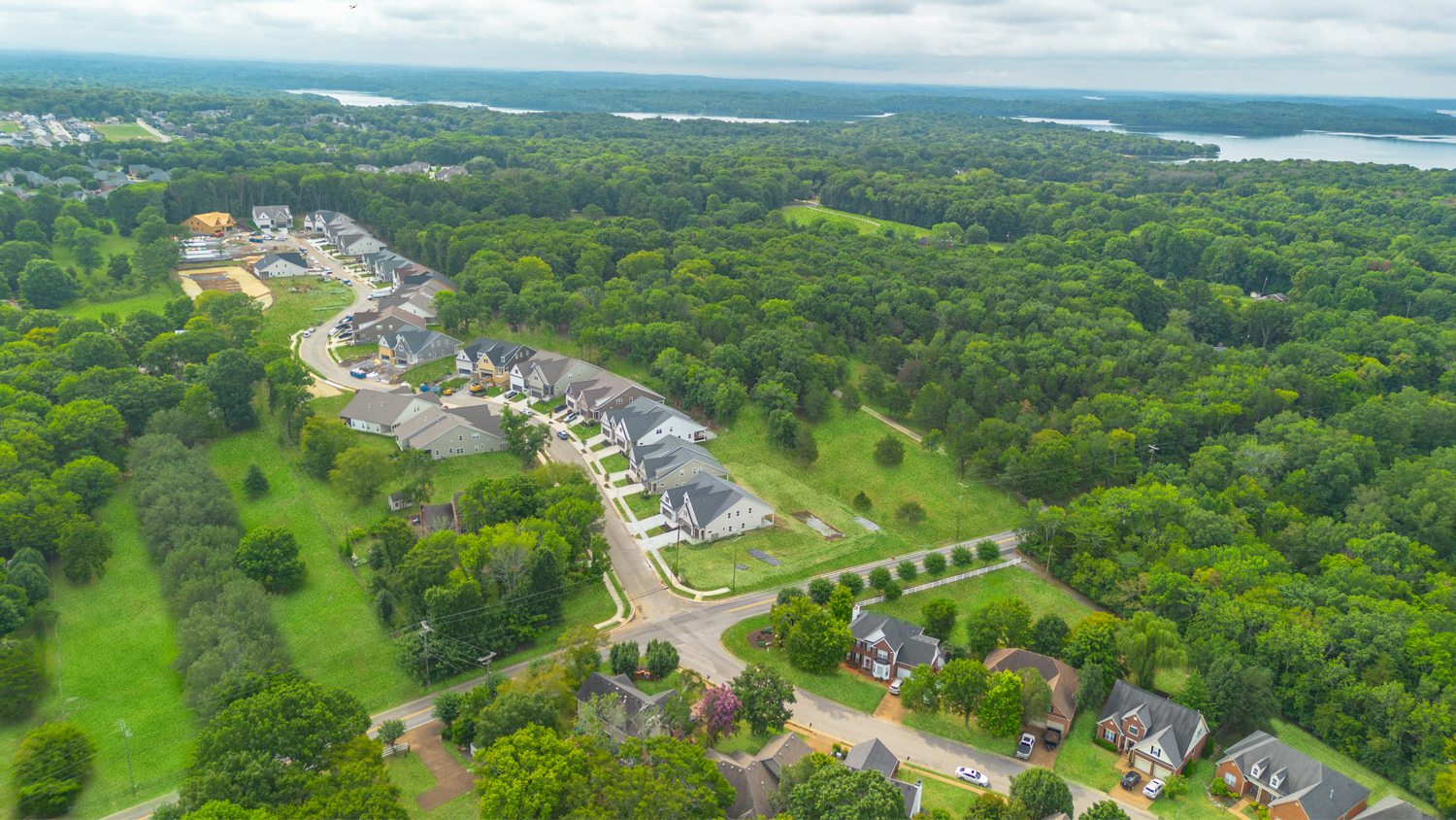 A landscape with houses and trees.