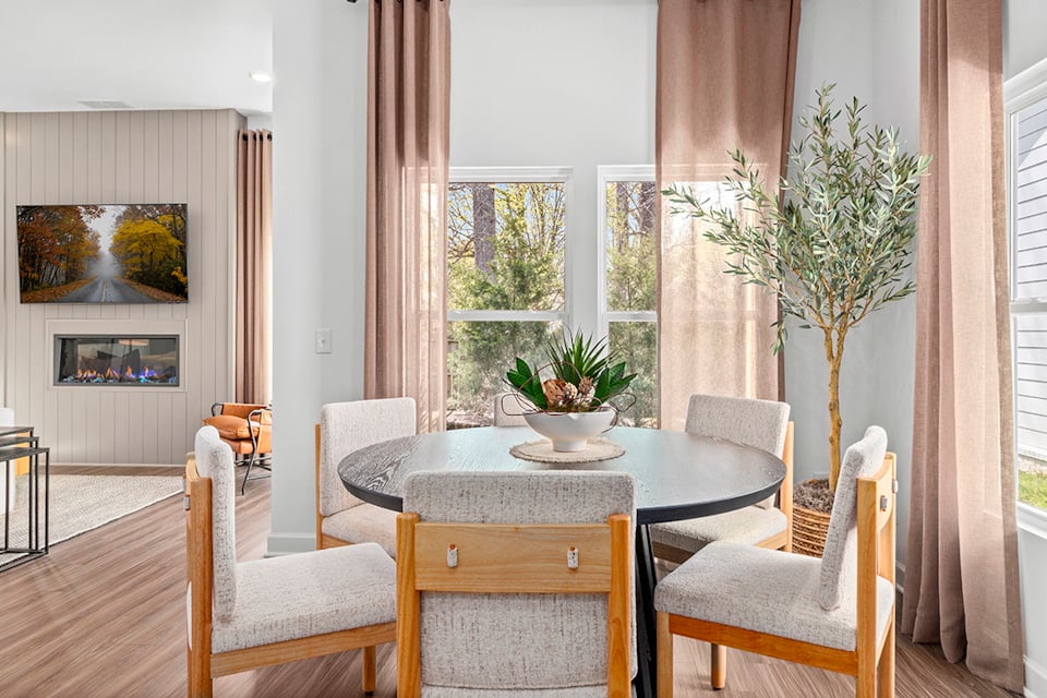 A room with a table and chairs.