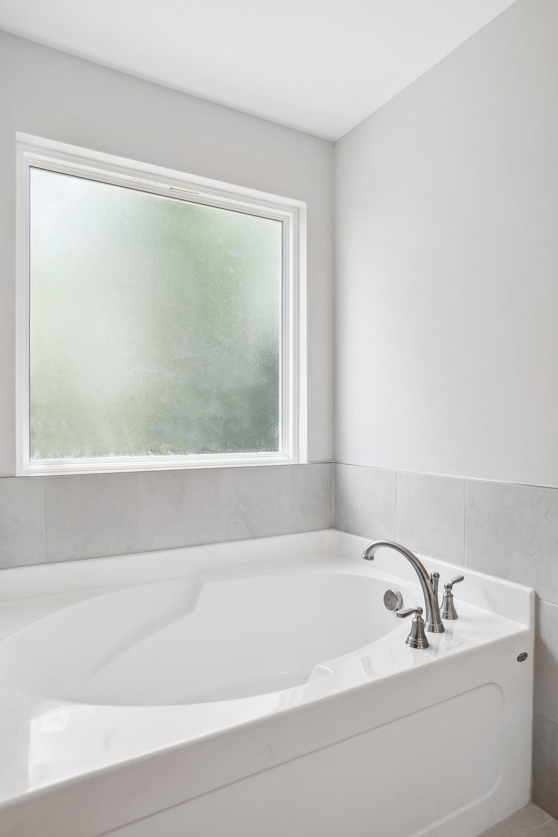A bathtub with a window.