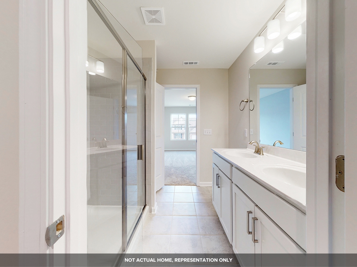 A bathroom with a glass shower.