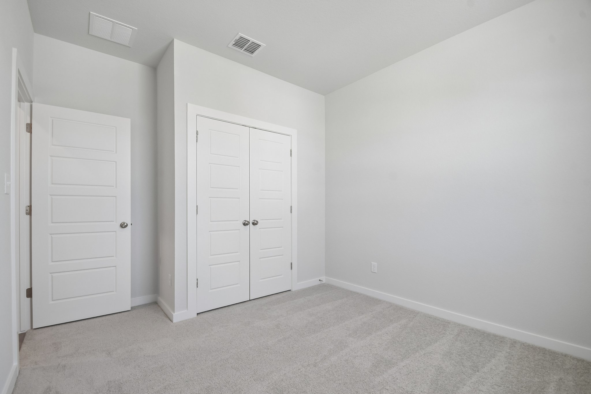 A room with white doors.