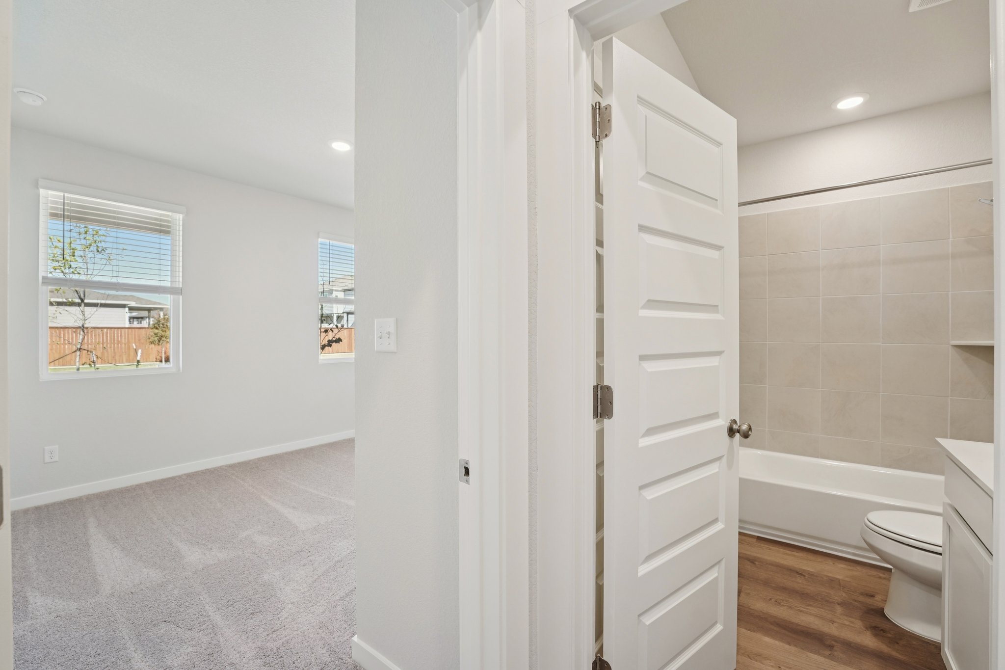 A bathroom with white walls.