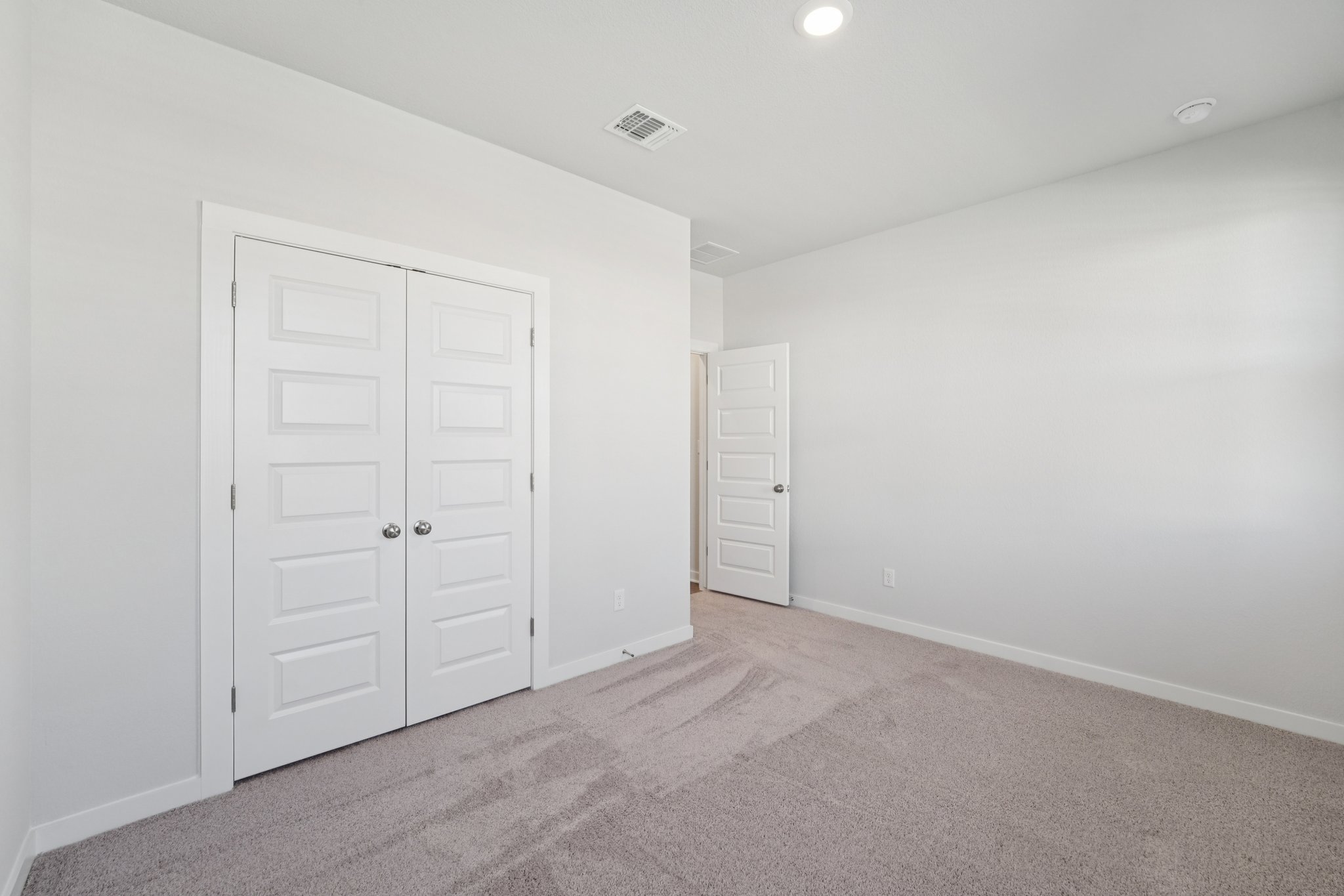 A room with white doors.