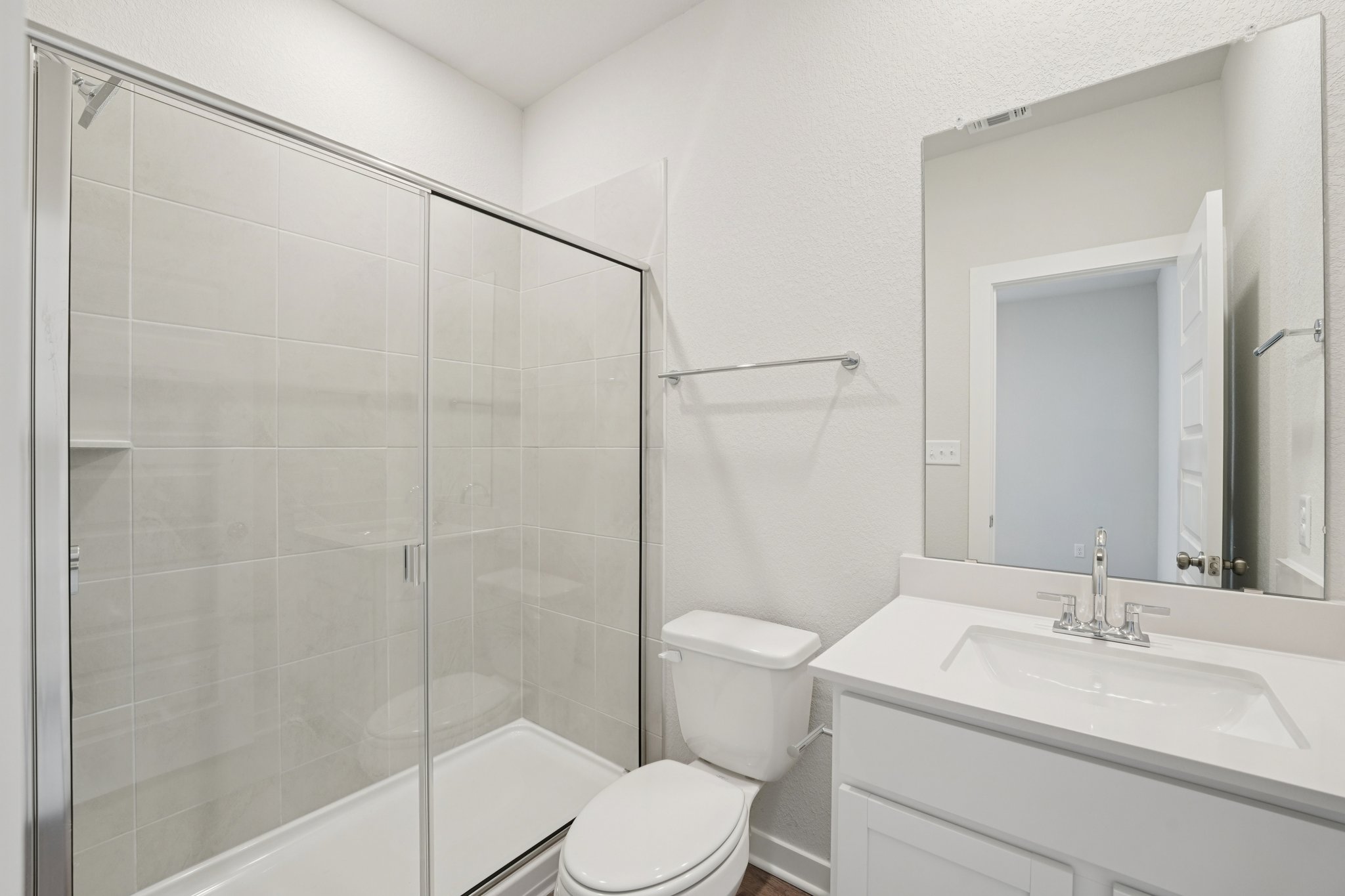 A bathroom with a glass shower.