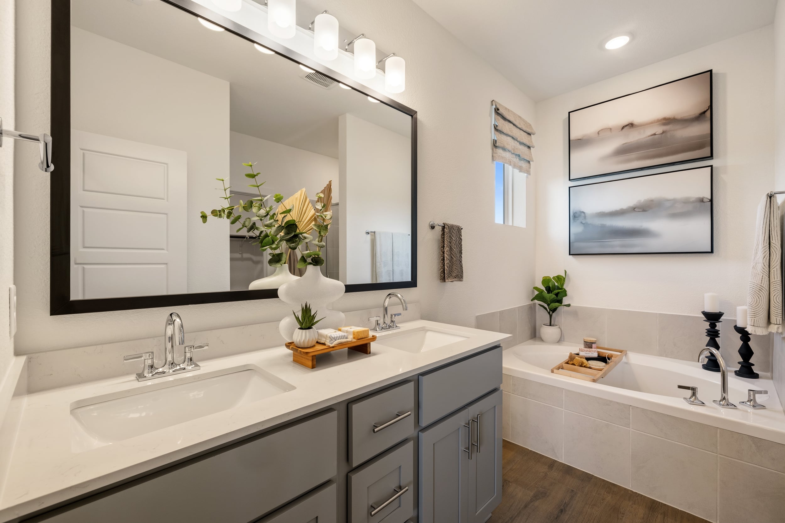A bathroom with a large mirror.