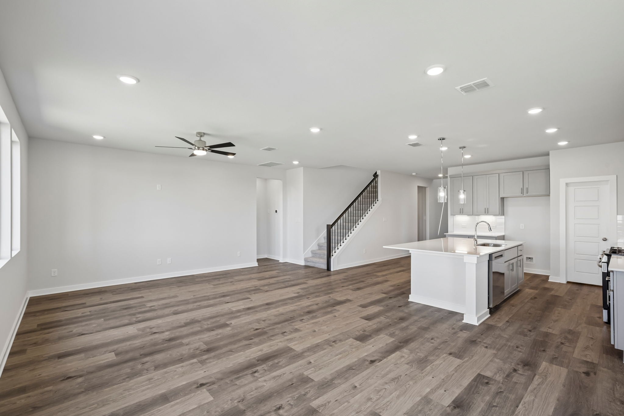 A large kitchen with white cabinets.