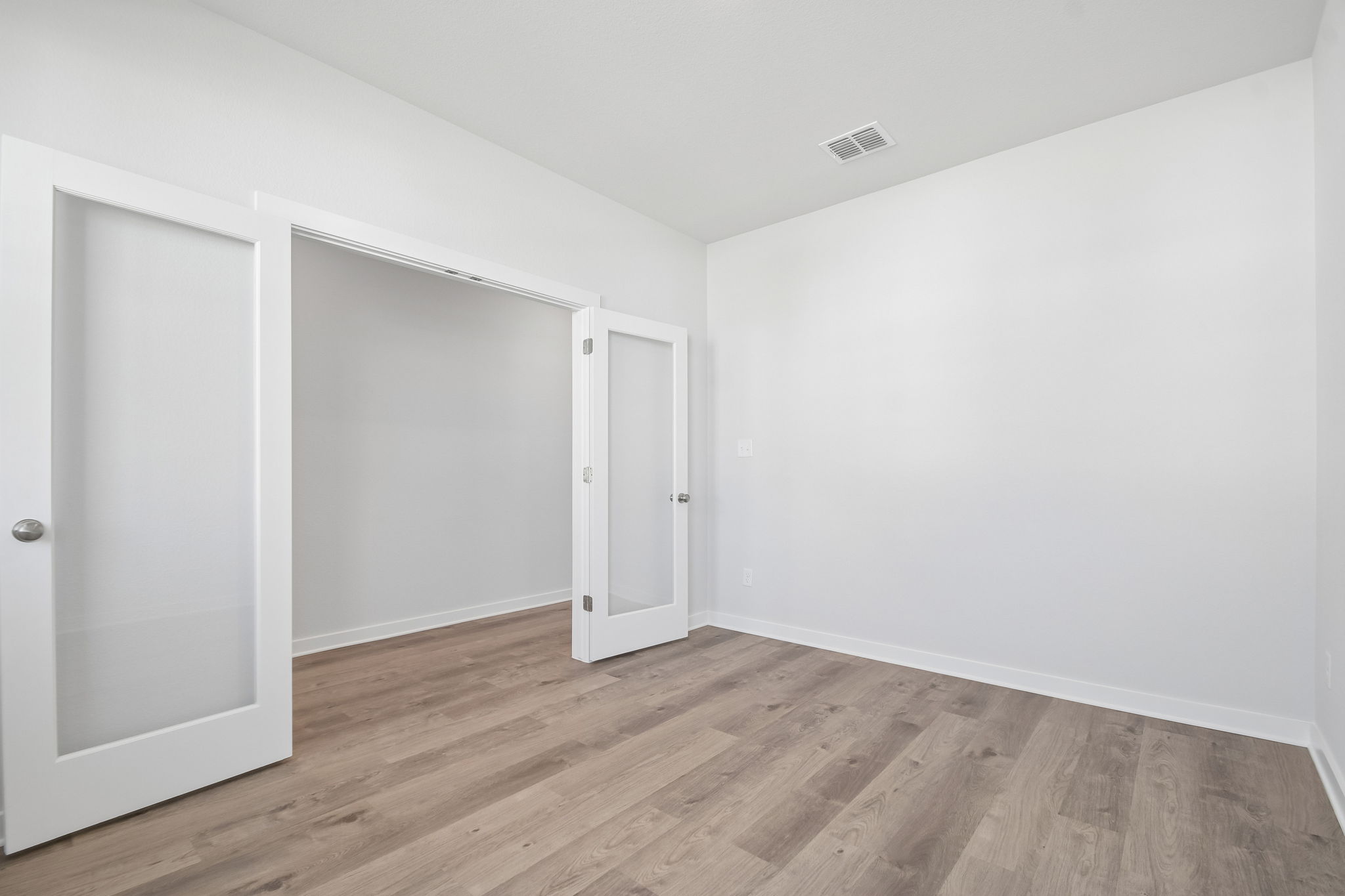 A room with white doors.
