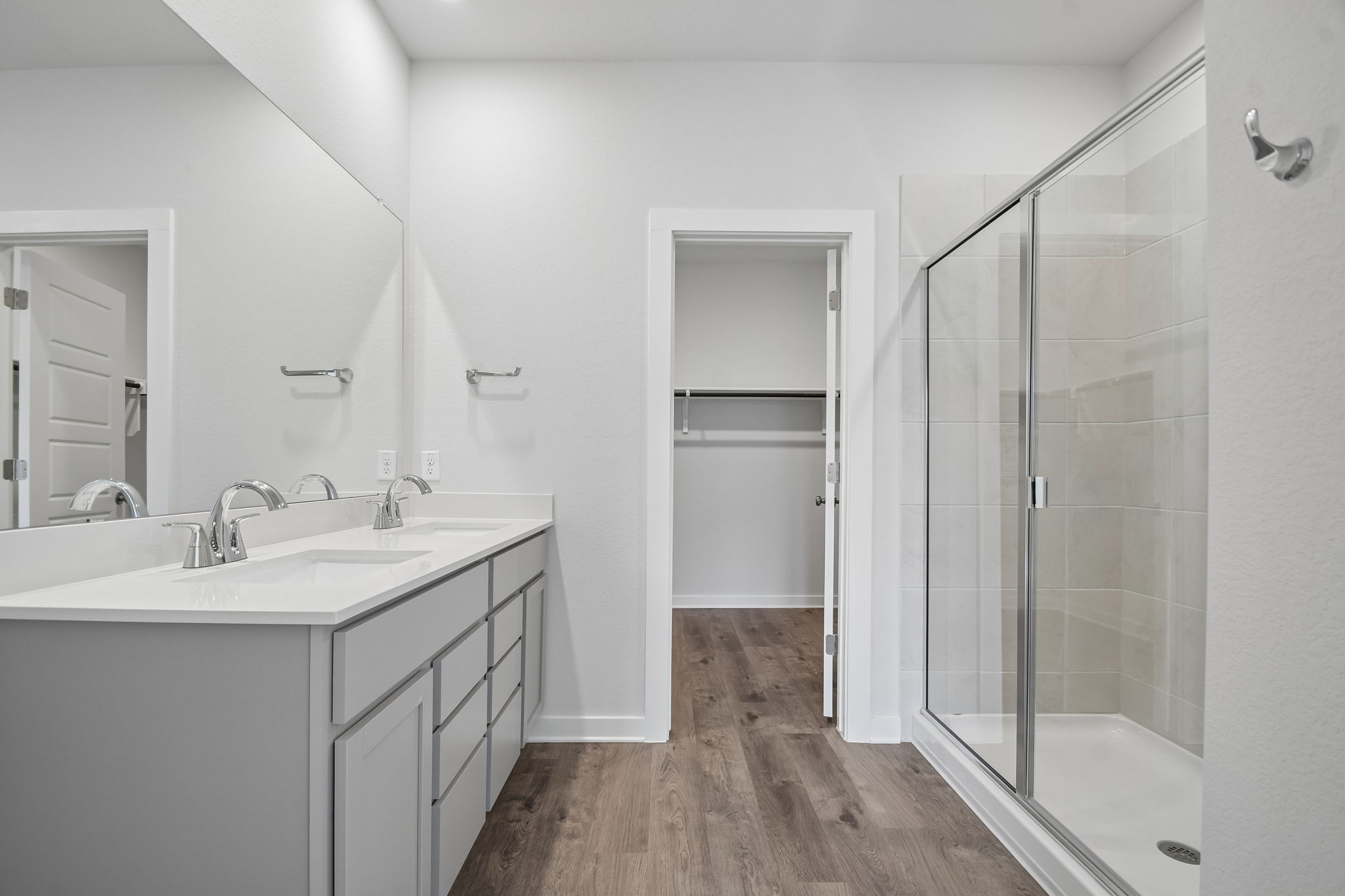 A bathroom with a glass shower.
