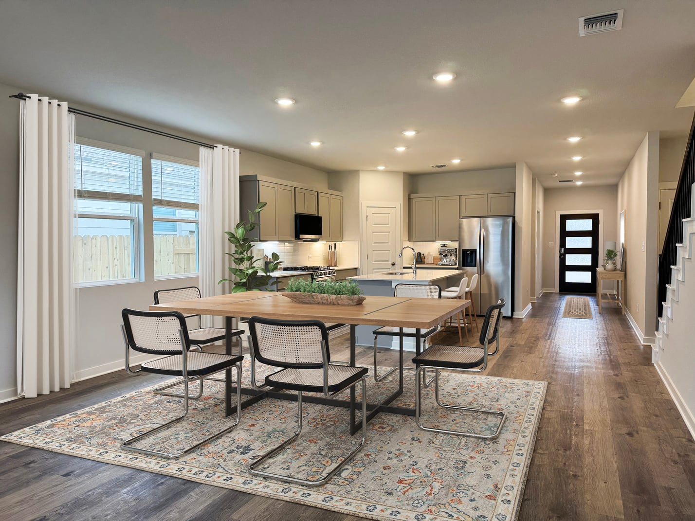 A kitchen with a dining table.