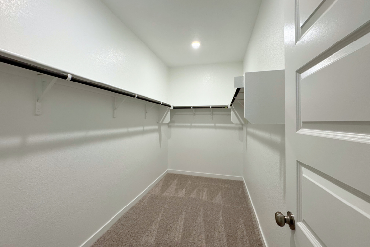 A hallway with white walls.