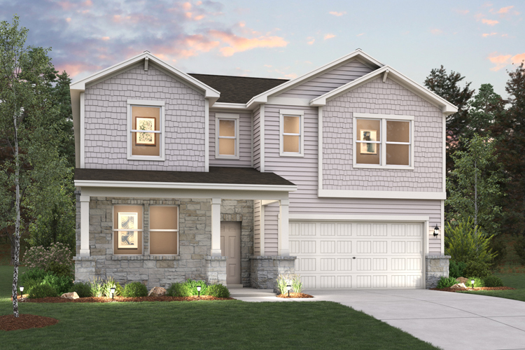 A house with a garage with trees in the background.