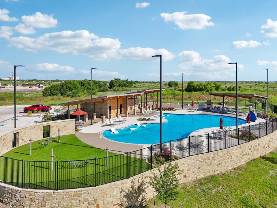 A swimming pool with a fence around it.