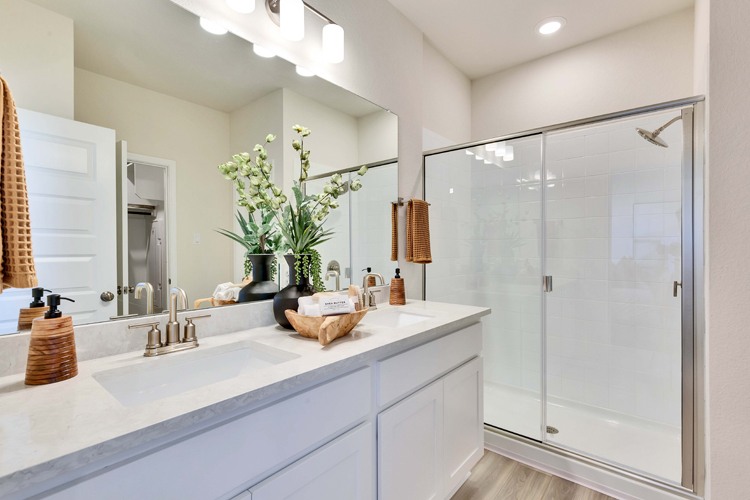 A bathroom with a large mirror.