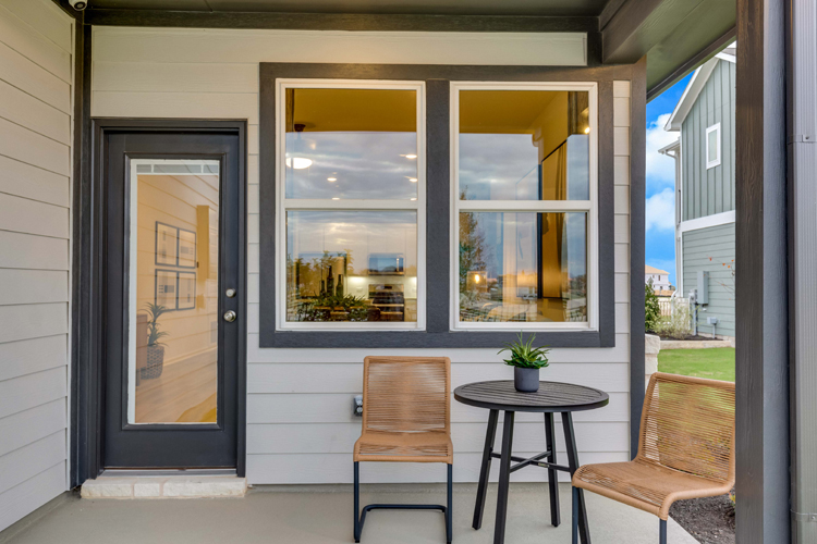 A table and chairs outside a building.