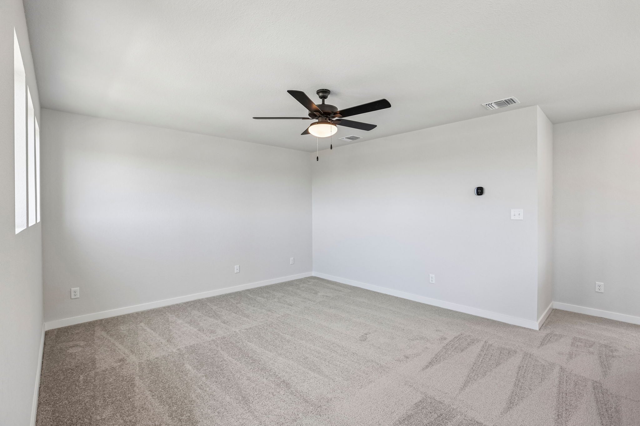 A ceiling fan in a room.