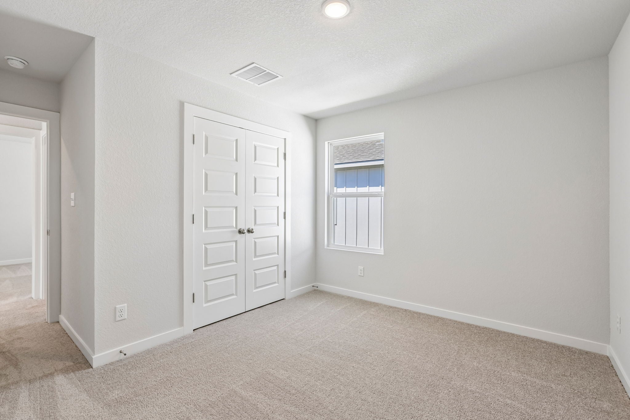 A room with white doors.