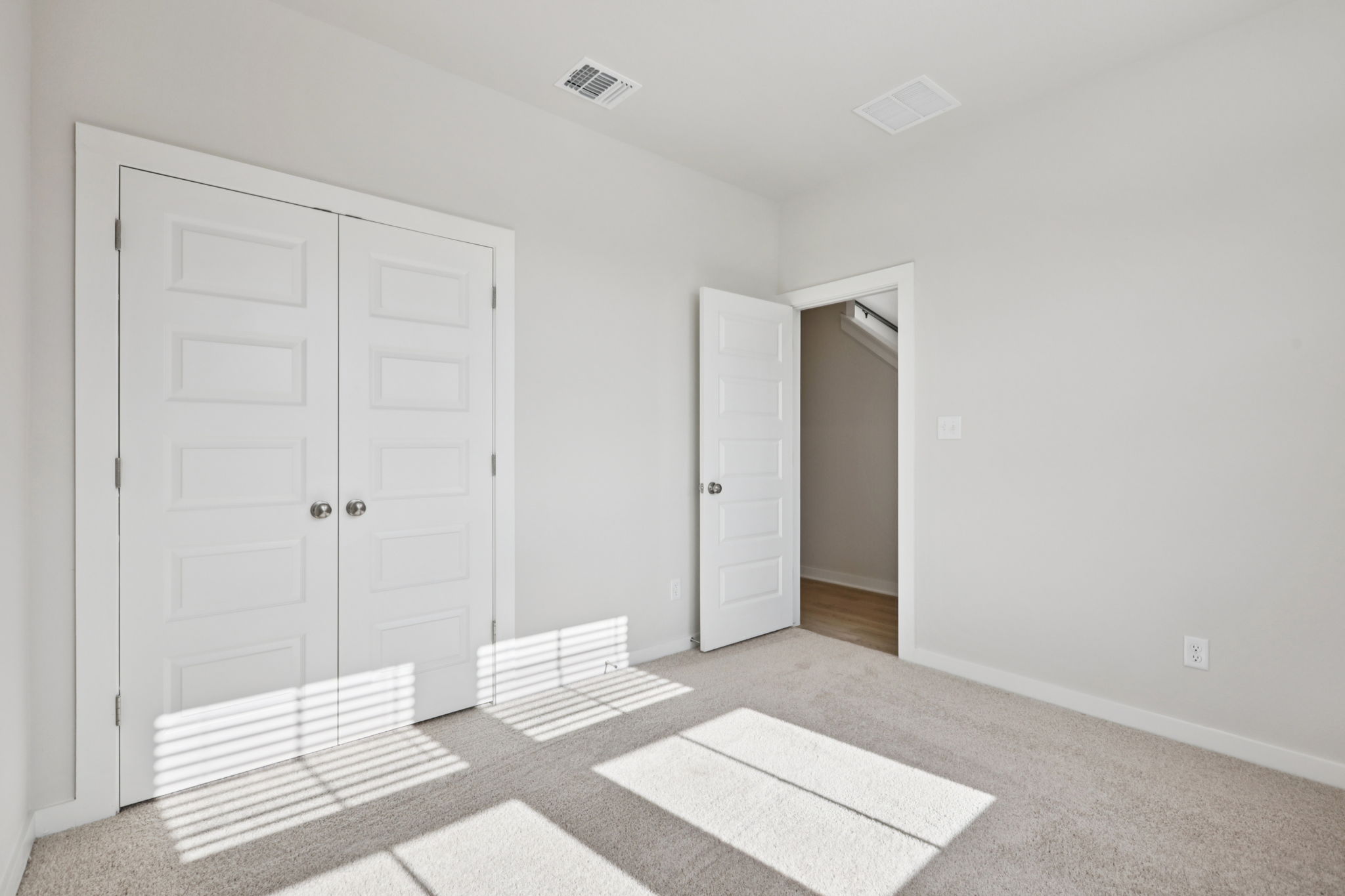 A room with white doors.