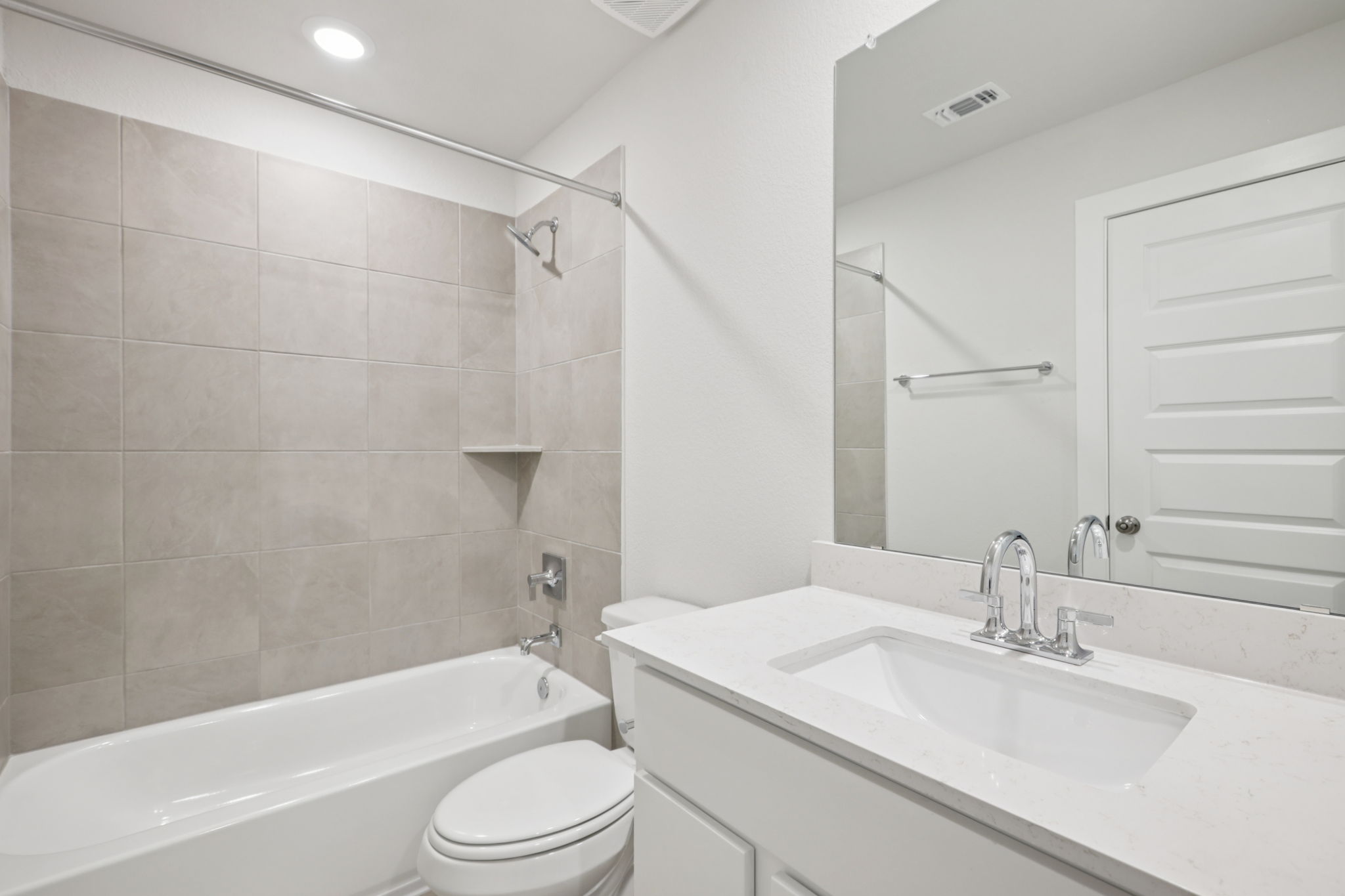 A bathroom with a sink and a bathtub.