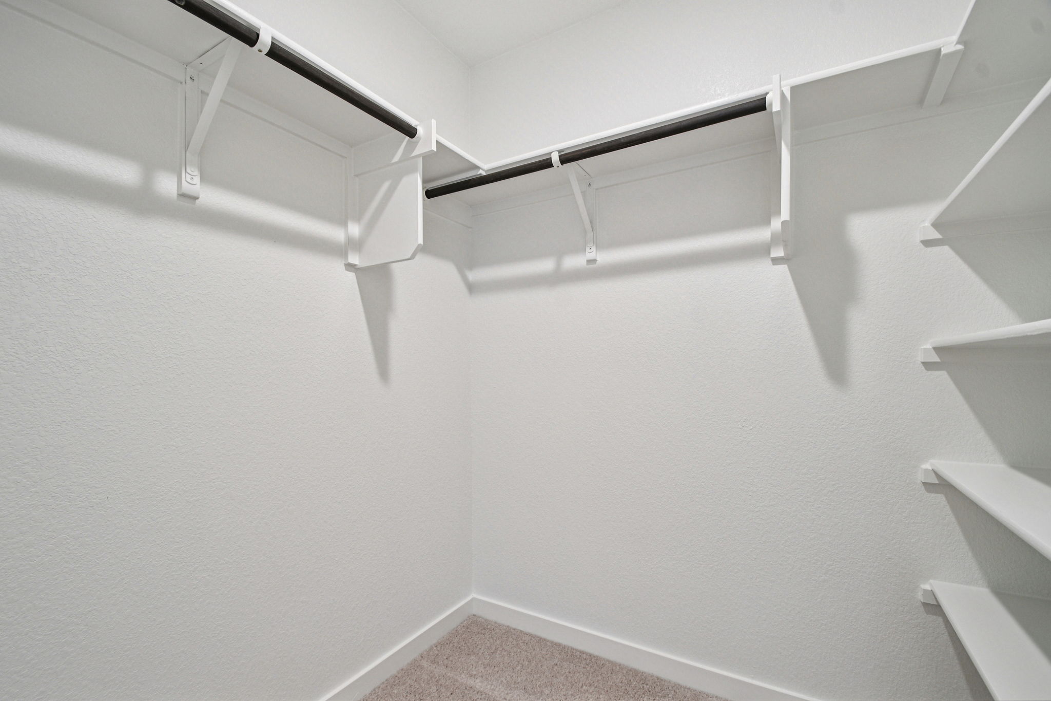 A white staircase with a white railing.