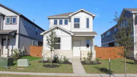 A white house with a fence.