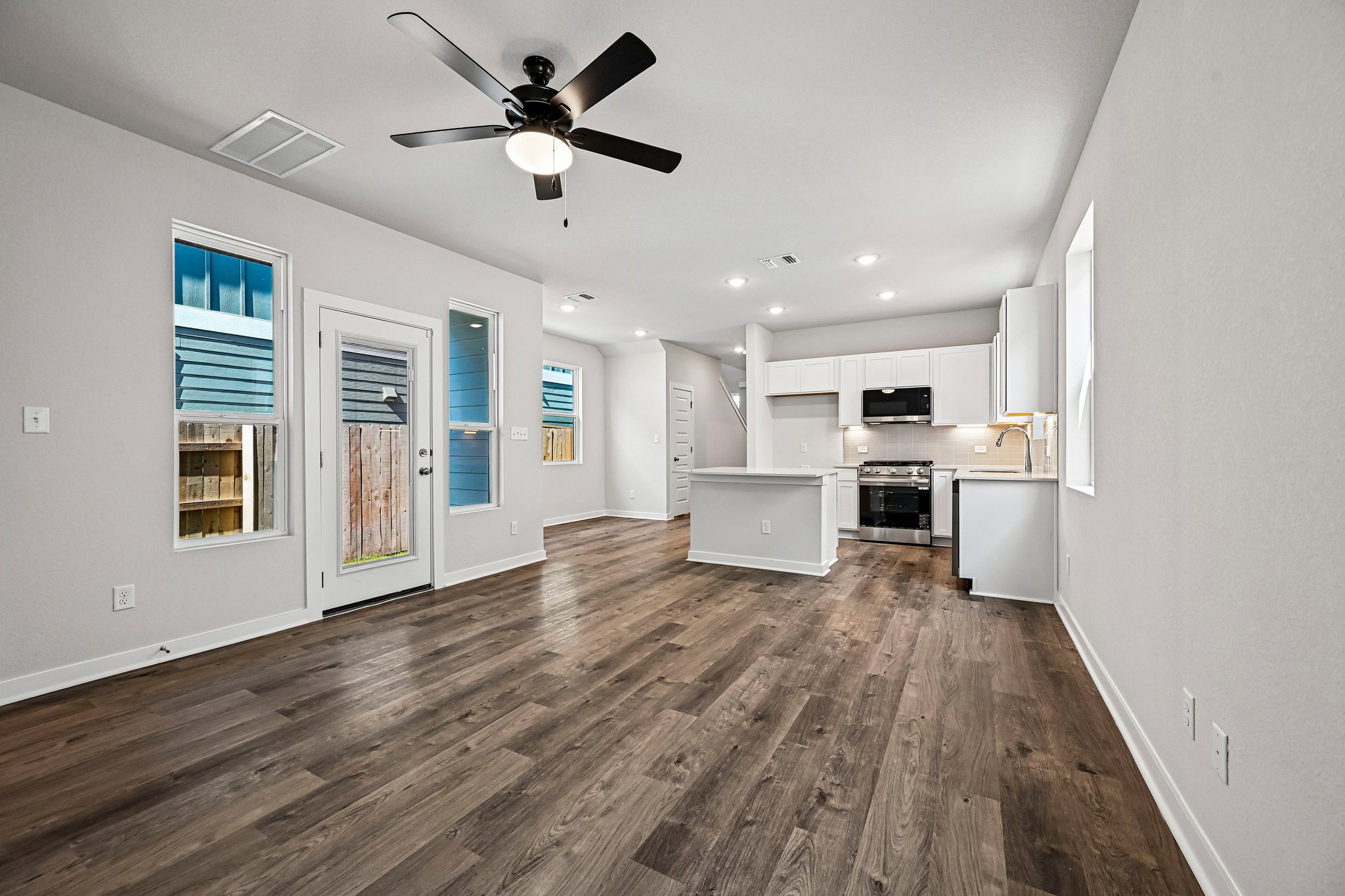 A kitchen with white walls.