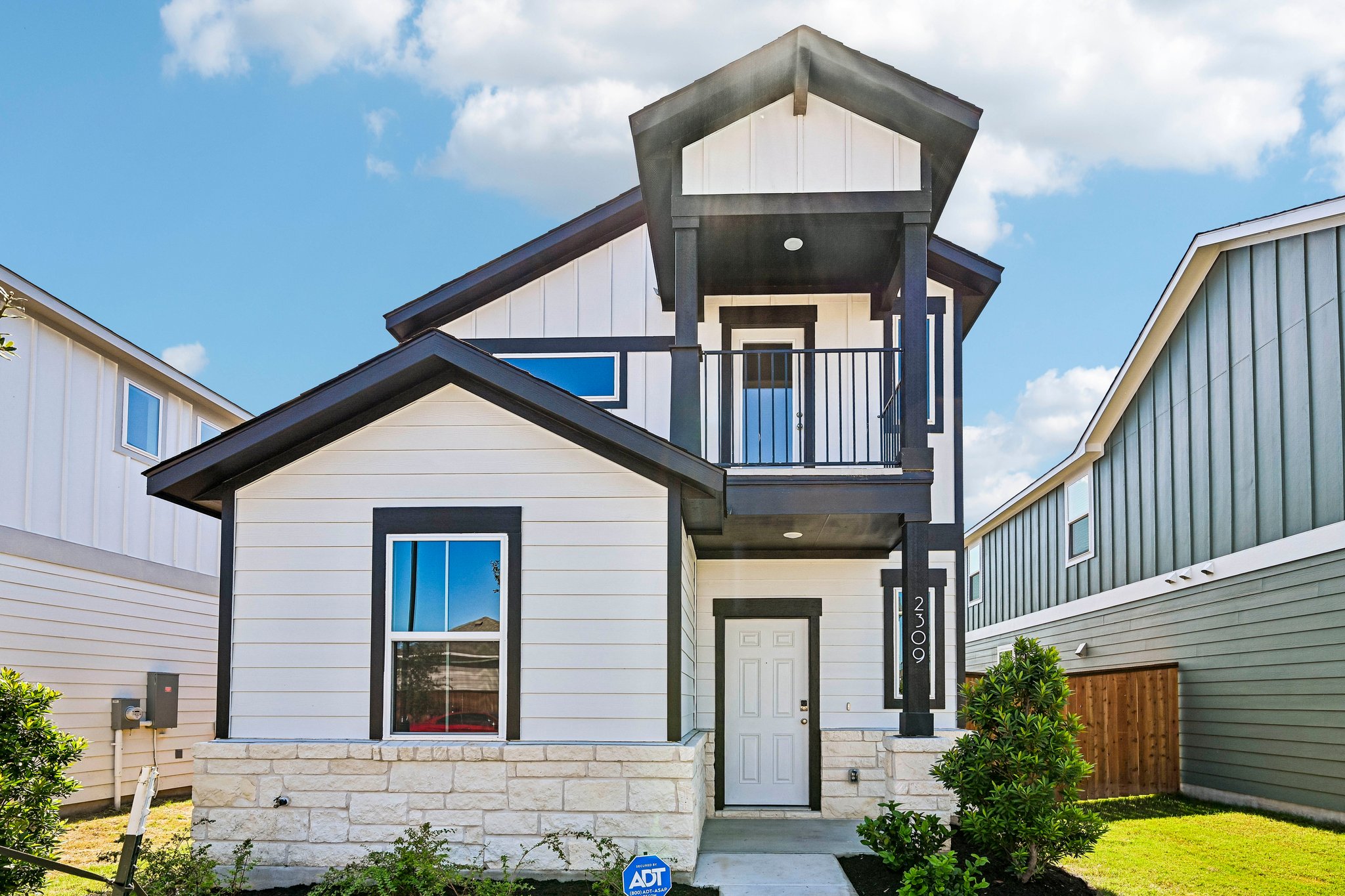 A house with a small balcony.