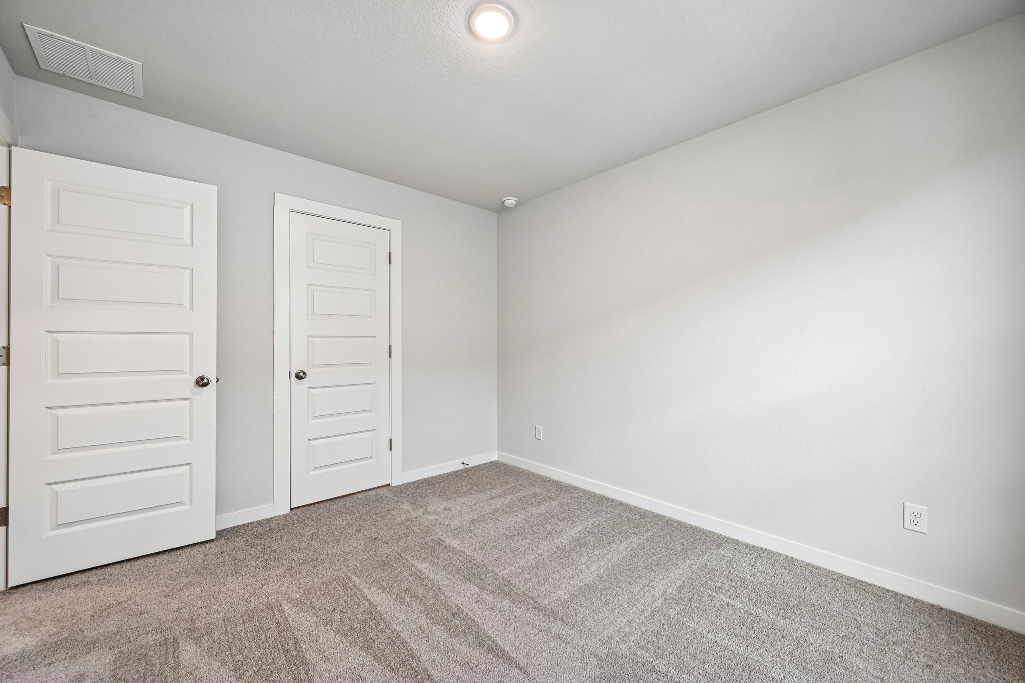 A room with white doors.