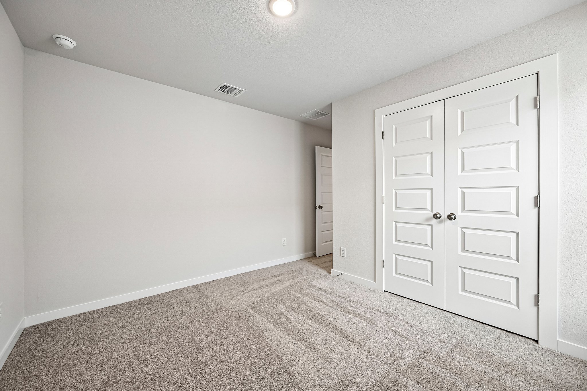 A room with white doors.