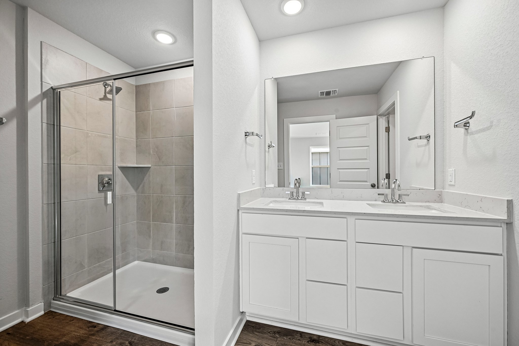 A bathroom with a glass shower.