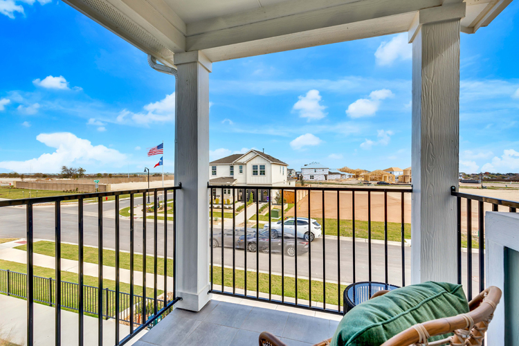 A person sitting on a balcony.