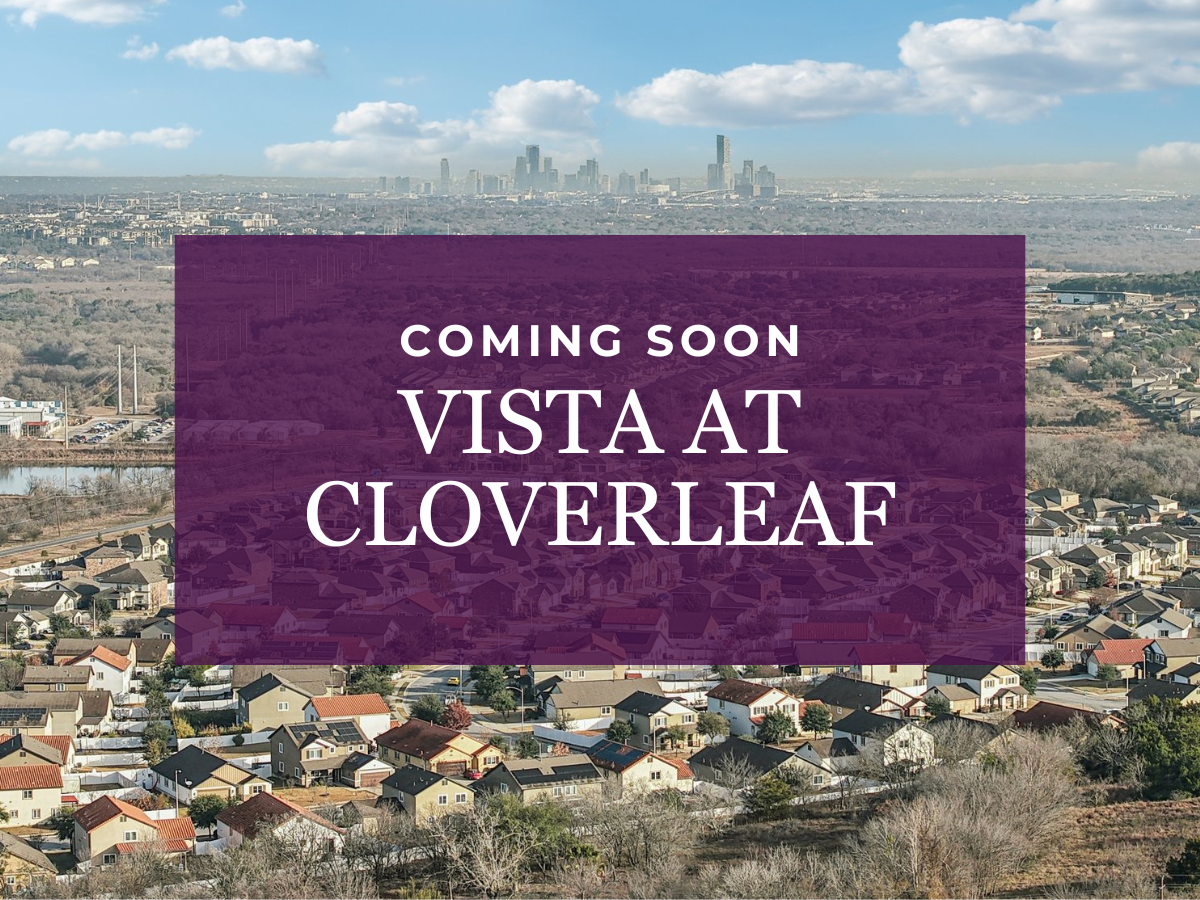 A sign with a city in the background.