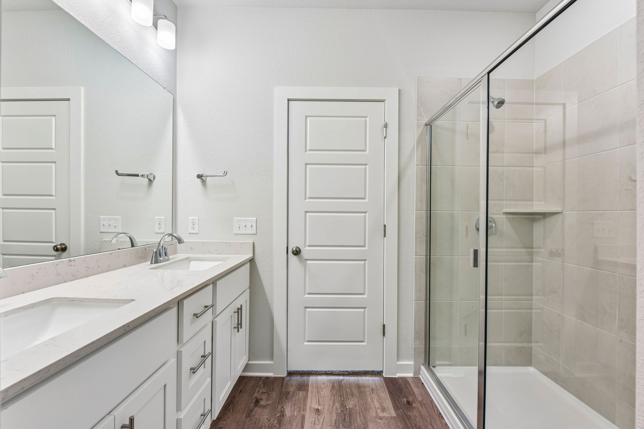 A bathroom with a glass shower.