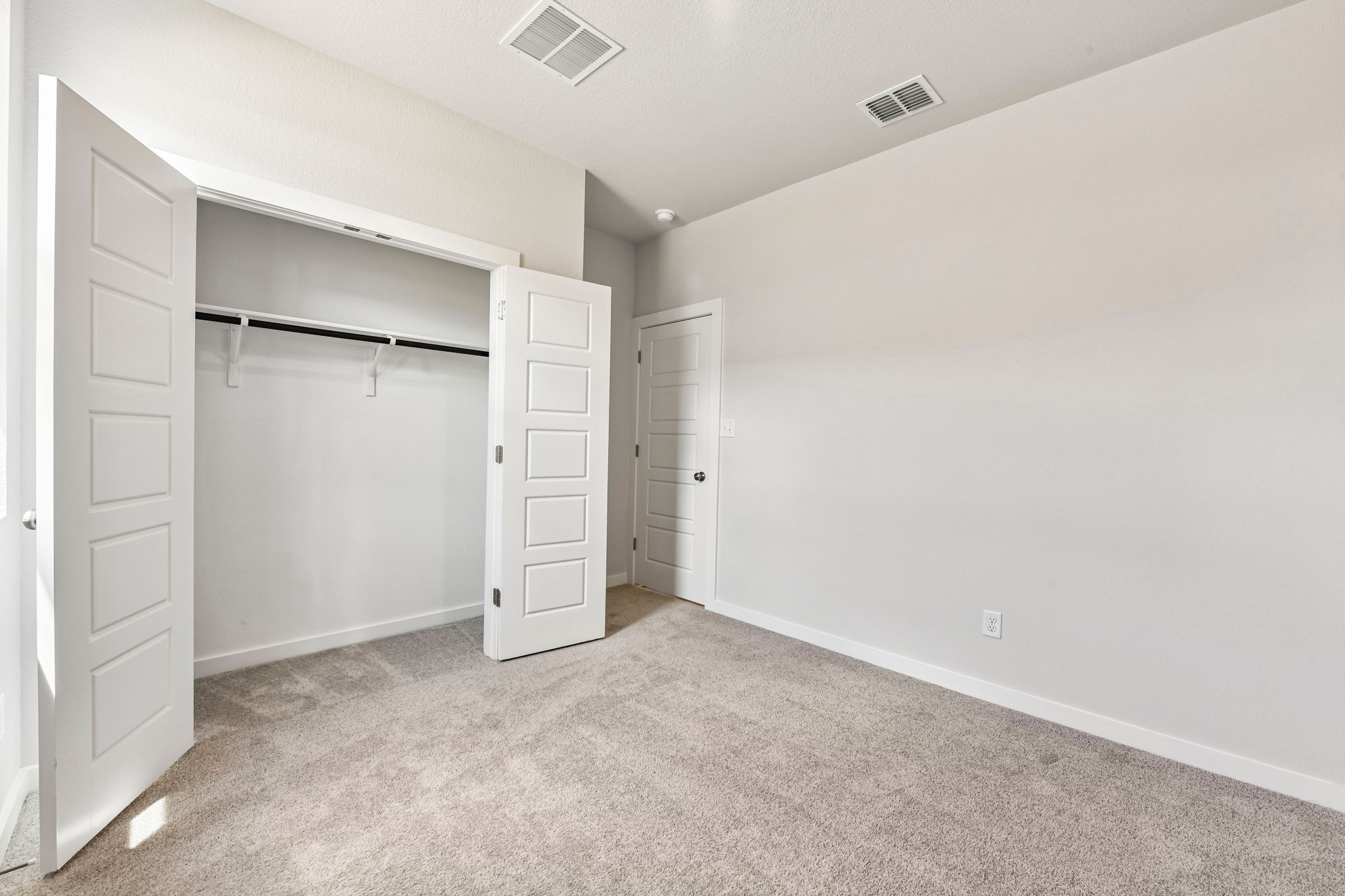 A room with white doors.