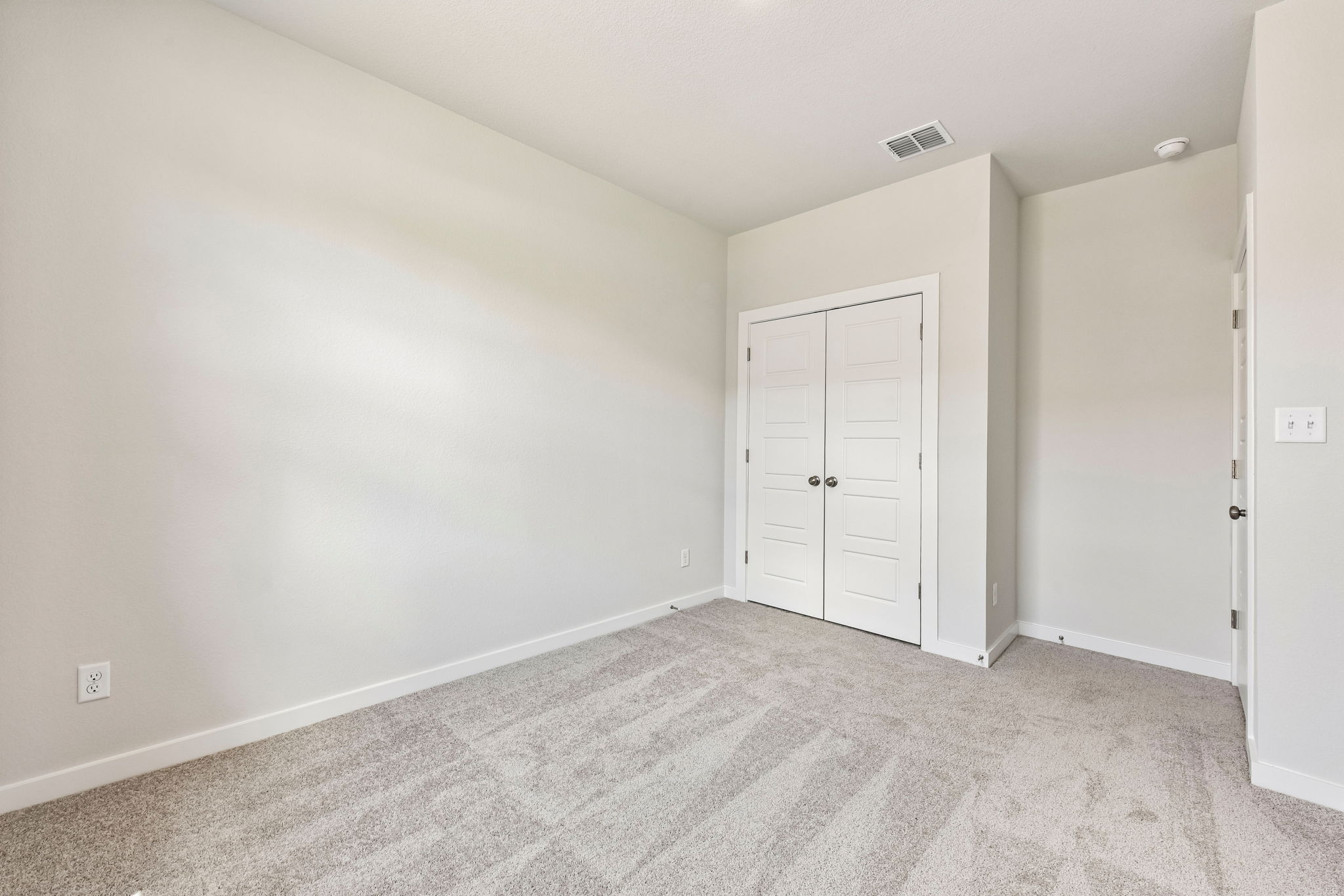 A room with white doors.
