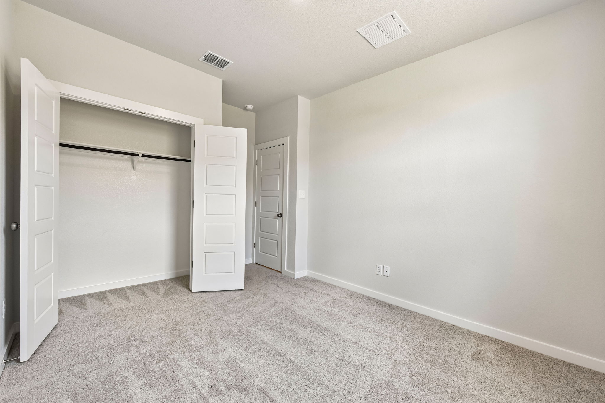 A room with white doors.