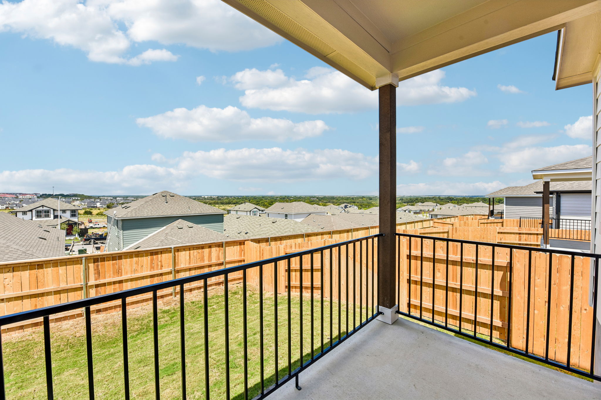 A balcony overlooking a town.