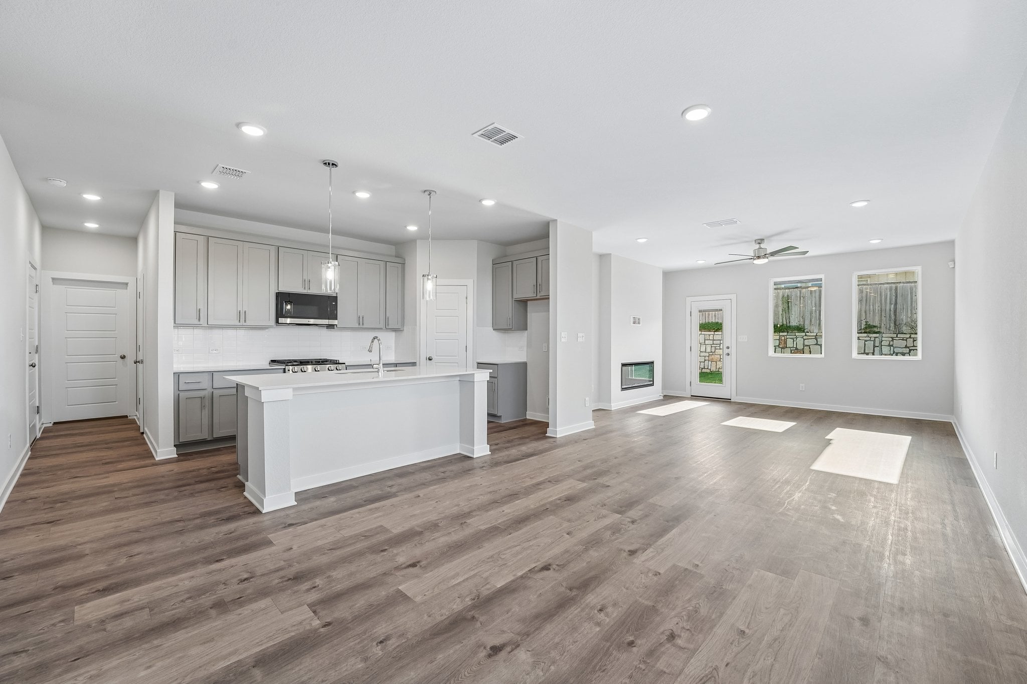 A large kitchen with white cabinets.