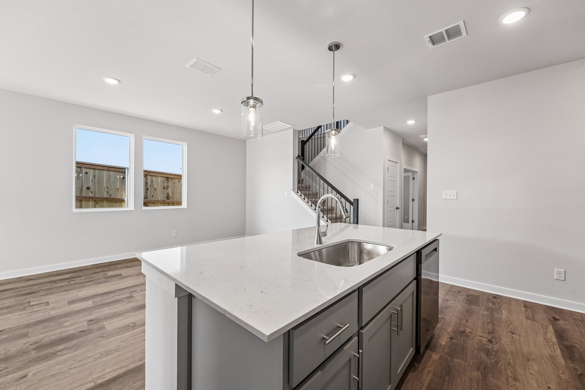 A kitchen with a marble countertop.