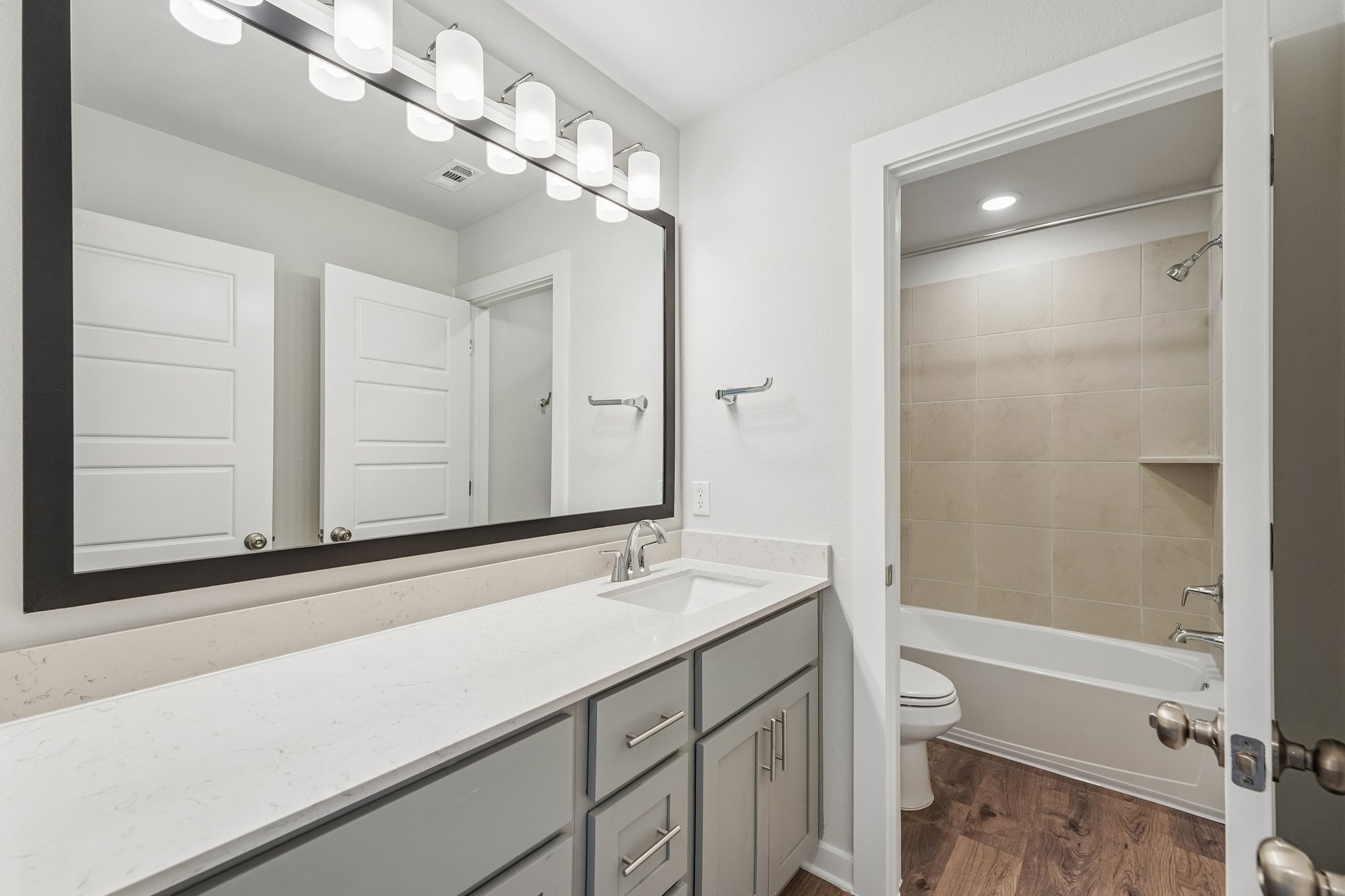 A bathroom with a glass shower.