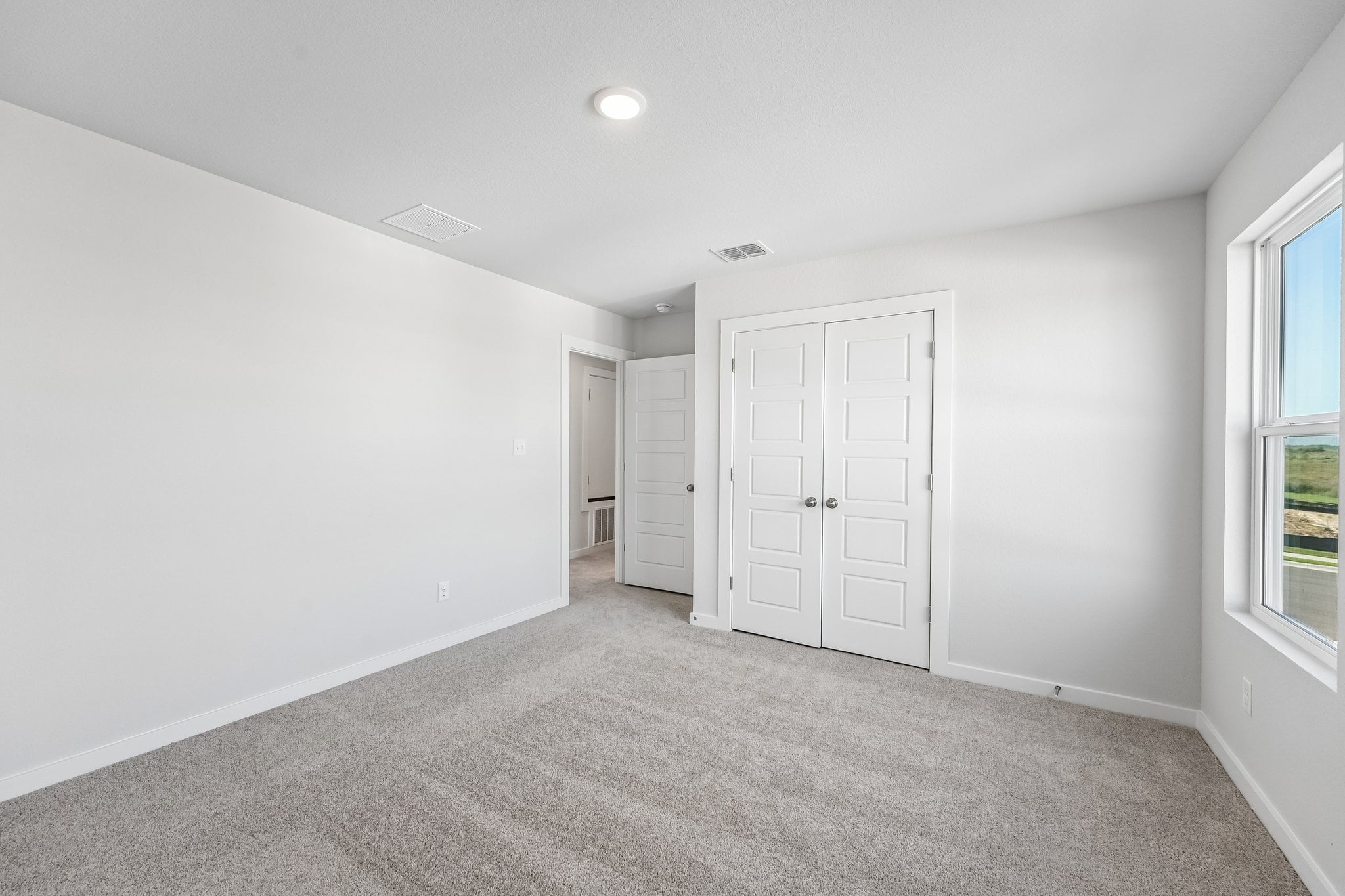 A room with white doors.